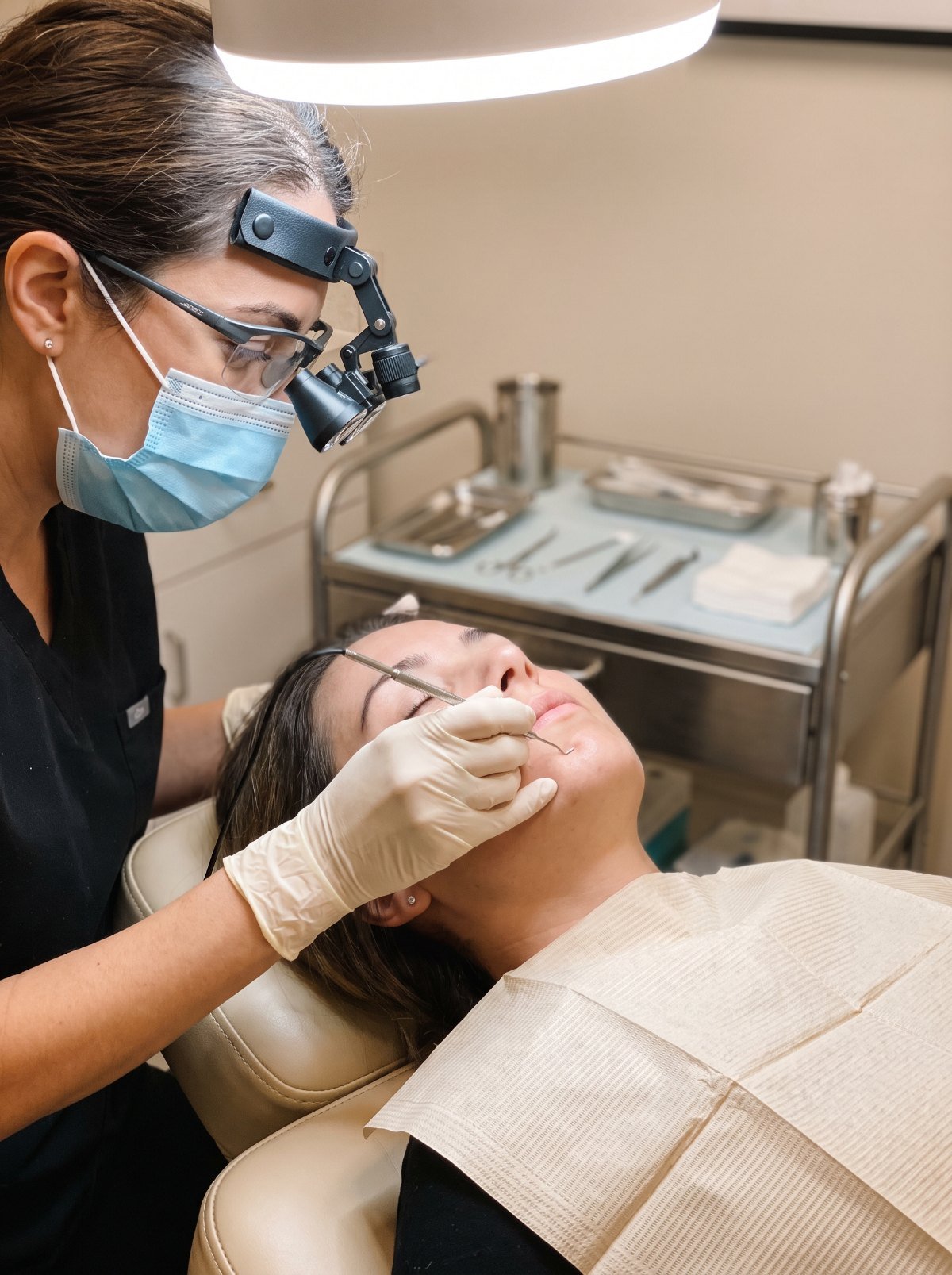 Electrologist treating chin hair with a fine probe